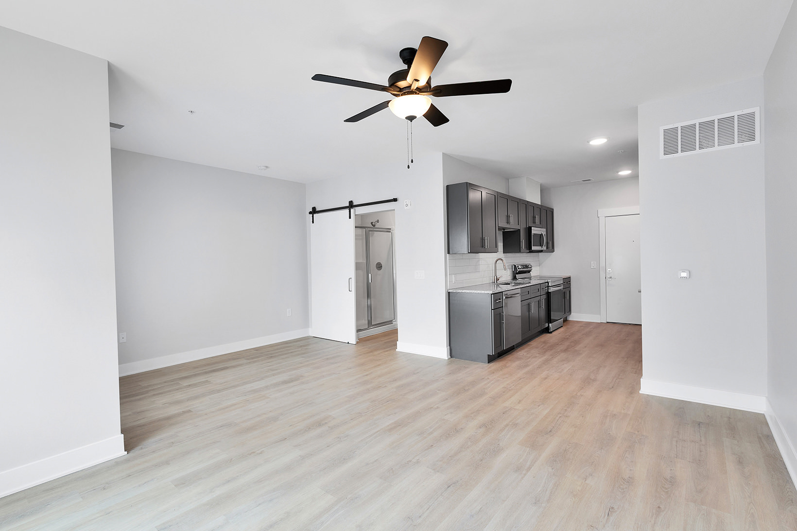 living room open to kitchen and bathroom